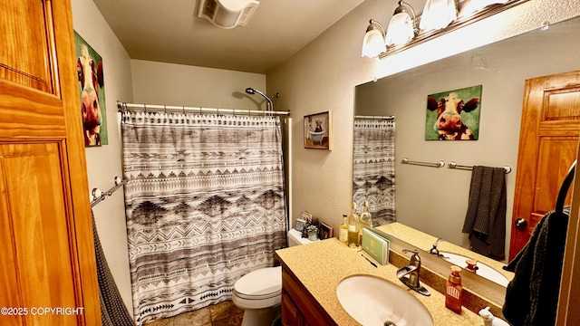 7191 S Yohn Bay Pl, Wasilla, AK 99623 - full bathroom with vanity, toilet, and curtained shower