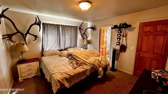 7191 S Yohn Bay Pl, Wasilla, AK 99623 - bedroom with dark colored carpet and ensuite bathroom