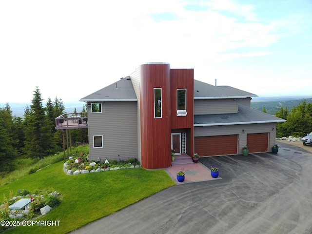 16971 Mount Mckinley View Dr, Anchorage, AK 99516 - view of front of home featuring a front lawn, asphalt driveway, and a garage