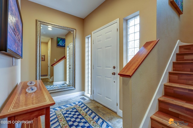 16971 Mount Mckinley View Dr, Anchorage, AK 99516 - foyer with stairs, baseboards, and stone tile flooring