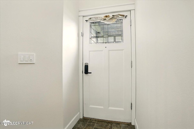 5846 Grand Teton Loop, Anchorage, AK 99502 - entryway featuring baseboards and stone finish floors