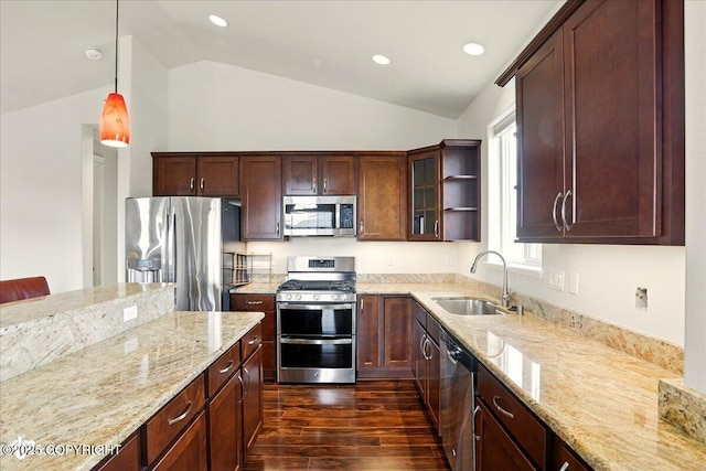 5846 Grand Teton Loop, Anchorage, AK 99502 - kitchen featuring stainless steel appliances, a sink, vaulted ceiling, light stone countertops, and dark wood-style flooring