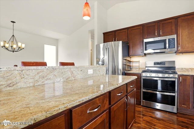 5846 Grand Teton Loop, Anchorage, AK 99502 - kitchen with appliances with stainless steel finishes, a chandelier, dark wood-style flooring, light stone countertops, and pendant lighting