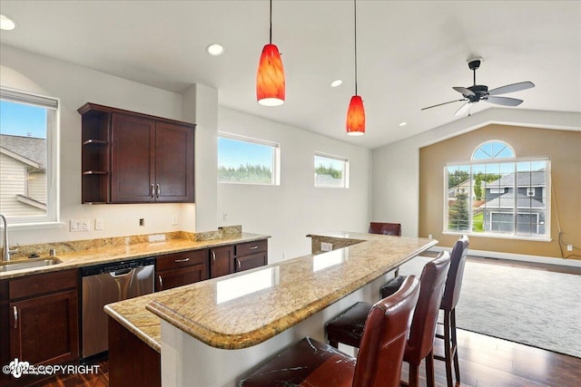 5846 Grand Teton Loop, Anchorage, AK 99502 - kitchen featuring dishwasher, a kitchen island, lofted ceiling, dark wood-type flooring, and a sink