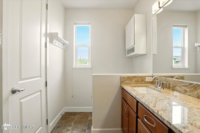 5846 Grand Teton Loop, Anchorage, AK 99502 - bathroom featuring vanity and baseboards
