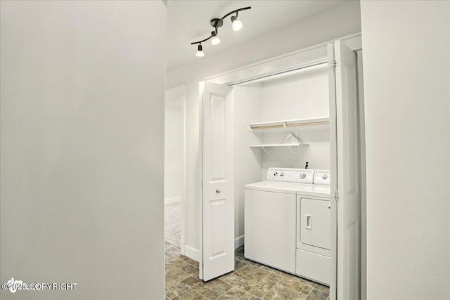 5846 Grand Teton Loop, Anchorage, AK 99502 - laundry area featuring washer and dryer and stone finish flooring
