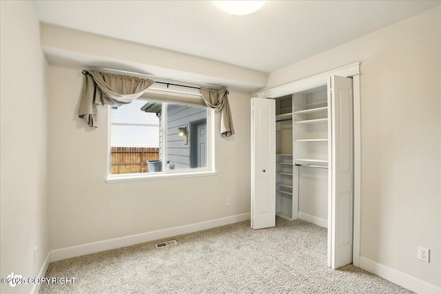 5846 Grand Teton Loop, Anchorage, AK 99502 - unfurnished bedroom with baseboards, carpet flooring, and a closet