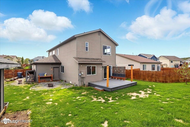 5846 Grand Teton Loop, Anchorage, AK 99502 - rear view of house with a deck, an outdoor fire pit, and a residential view
