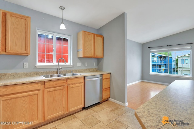 17480 Beaujolais Cir, Eagle River, AK 99577 - kitchen featuring dishwasher, a sink, light brown cabinetry, vaulted ceiling, and light countertops