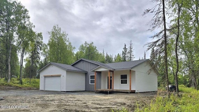 680 Wortham Ave, Kenai, AK 99611 - ranch-style house with an attached garage and dirt driveway