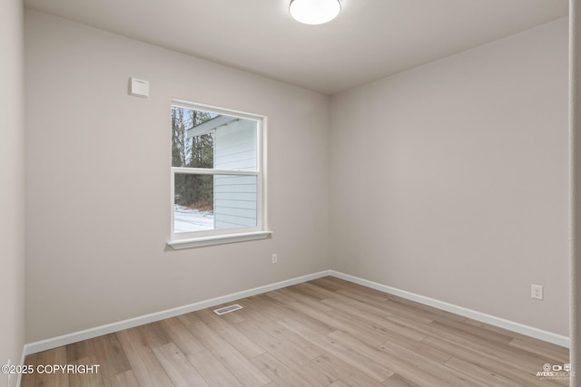 680 Wortham Ave, Kenai, AK 99611 - unfurnished room featuring light wood-style flooring and baseboards
