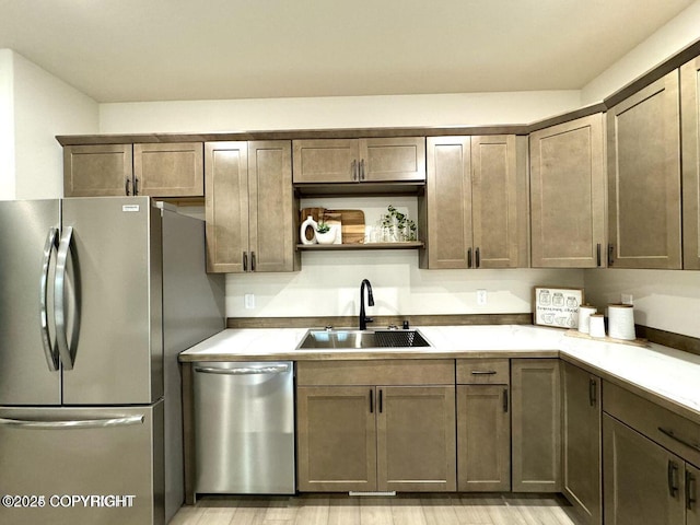 680 Wortham Ave, Kenai, AK 99611 - kitchen with appliances with stainless steel finishes, a sink, and open shelves