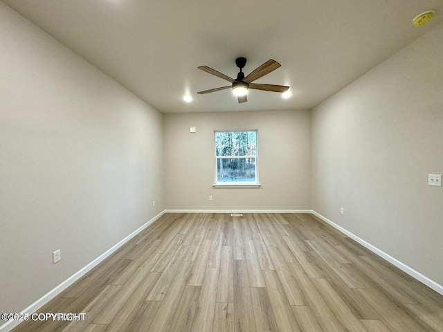 680 Wortham Ave, Kenai, AK 99611 - unfurnished room featuring a ceiling fan, wood finished floors, and baseboards