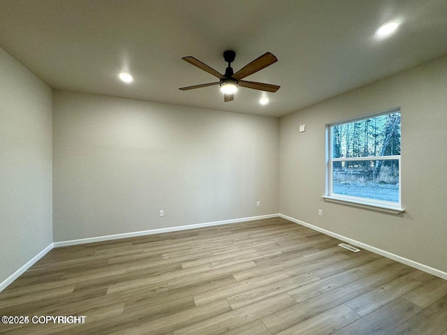 680 Wortham Ave, Kenai, AK 99611 - spare room featuring ceiling fan, wood finished floors, baseboards, and recessed lighting