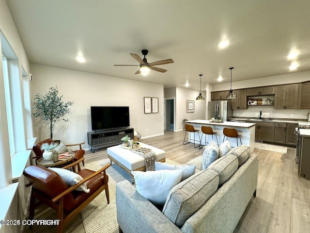 680 Wortham Ave, Kenai, AK 99611 - living area with light wood-style flooring, baseboards, a ceiling fan, and recessed lighting