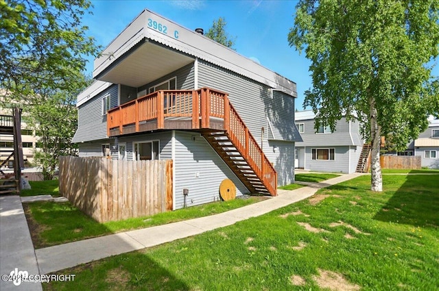 3962 Reka Dr # C1, Anchorage, AK 99508 - rear view of property with stairs and a wooden deck