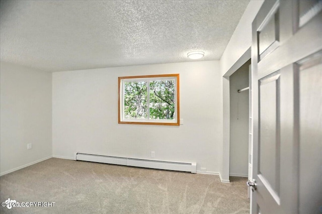 3962 Reka Dr # C1, Anchorage, AK 99508 - unfurnished bedroom with a baseboard heating unit, carpet, a textured ceiling, and baseboards