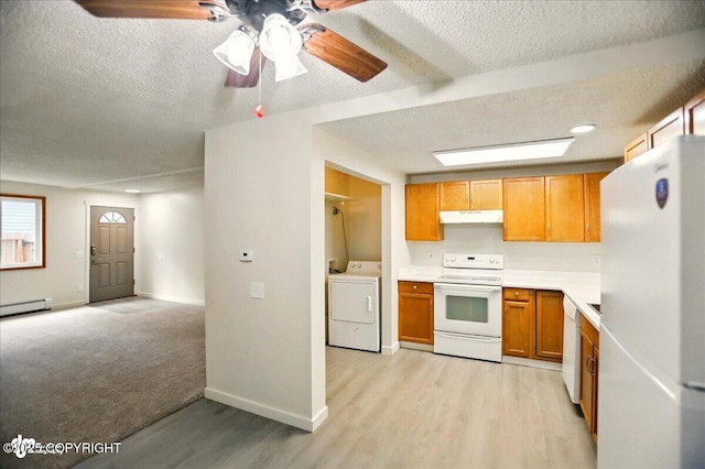 3962 Reka Dr # C1, Anchorage, AK 99508 - kitchen with white appliances, washer / clothes dryer, under cabinet range hood, a textured ceiling, and baseboards