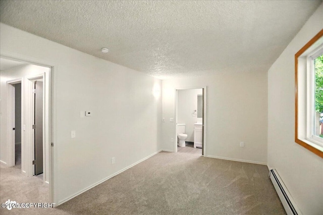 3962 Reka Dr # C1, Anchorage, AK 99508 - unfurnished room with a baseboard heating unit, light colored carpet, a textured ceiling, and baseboards