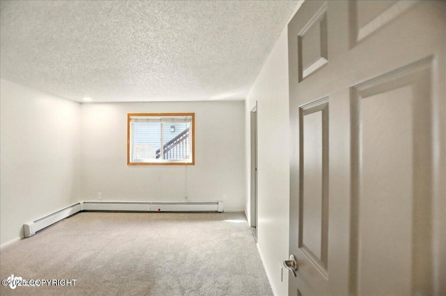 3962 Reka Dr # C1, Anchorage, AK 99508 - carpeted spare room featuring a textured ceiling and baseboards