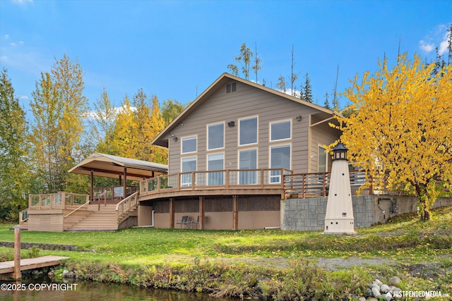 5322 S Big Lake Rd, Big Lake, AK 99652 - rear view of property featuring a deck, stairs, and a lawn
