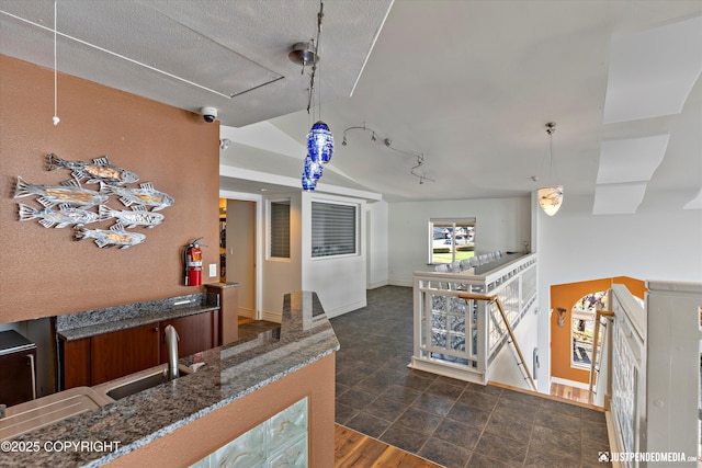 5322 S Big Lake Rd, Big Lake, AK 99652 - bar with lofted ceiling, rail lighting, and hanging light fixtures