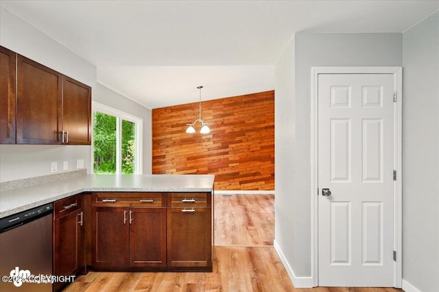 835 W Wilder Ave, Wasilla, AK 99654 - kitchen with dishwasher, wooden walls, a peninsula, light countertops, and light wood-type flooring