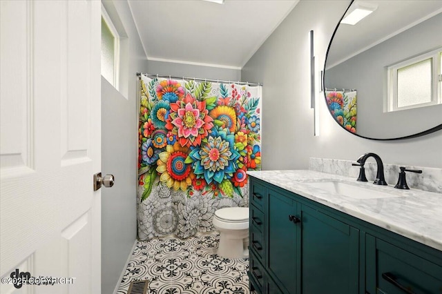 835 W Wilder Ave, Wasilla, AK 99654 - full bathroom featuring vanity, plenty of natural light, curtained shower, ornamental molding, and tile patterned flooring