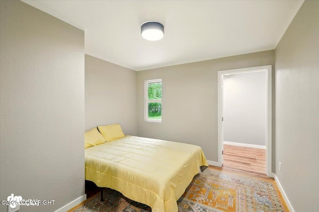 835 W Wilder Ave, Wasilla, AK 99654 - bedroom featuring wood finished floors and baseboards