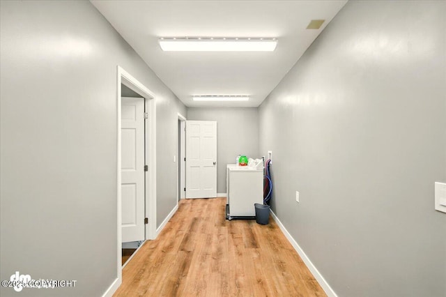 835 W Wilder Ave, Wasilla, AK 99654 - hallway with washer / clothes dryer and light wood finished floors