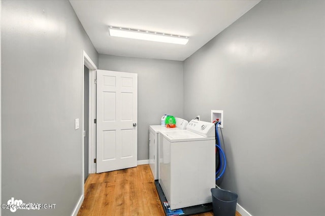 835 W Wilder Ave, Wasilla, AK 99654 - washroom featuring independent washer and dryer and light wood finished floors