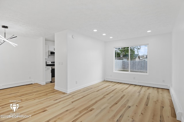 10108 Thimble Berry Dr, Anchorage, AK 99515 - unfurnished room featuring baseboard heating, light wood-style floors, a chandelier, recessed lighting, and a textured ceiling