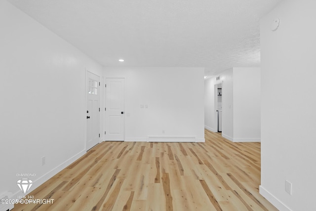 10108 Thimble Berry Dr, Anchorage, AK 99515 - unfurnished room with baseboards, light wood finished floors, and recessed lighting