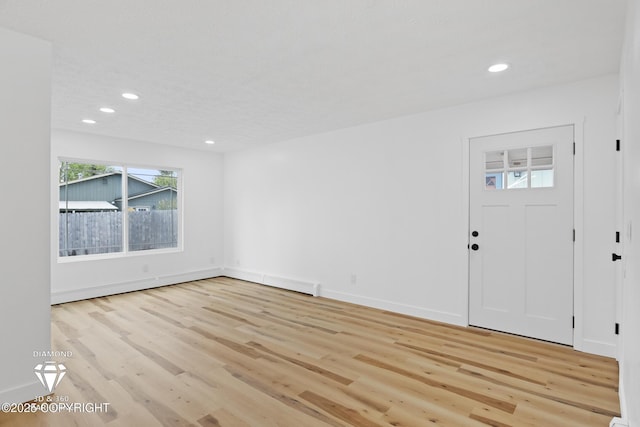 10108 Thimble Berry Dr, Anchorage, AK 99515 - entryway featuring recessed lighting, light wood finished floors, and baseboards