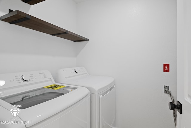 10108 Thimble Berry Dr, Anchorage, AK 99515 - laundry area featuring separate washer and dryer