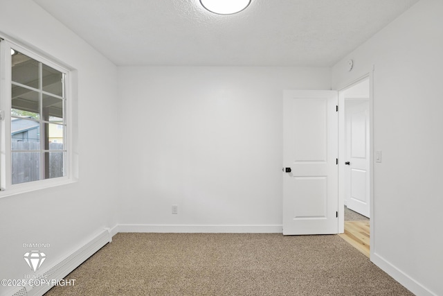 10108 Thimble Berry Dr, Anchorage, AK 99515 - spare room with light colored carpet, baseboards, and a baseboard radiator