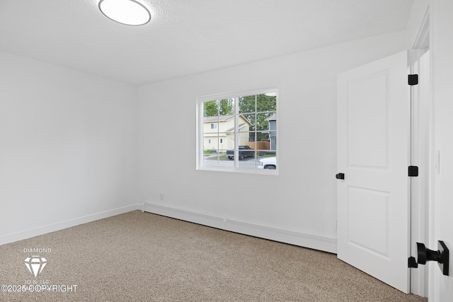 10108 Thimble Berry Dr, Anchorage, AK 99515 - carpeted empty room featuring a baseboard heating unit and baseboards
