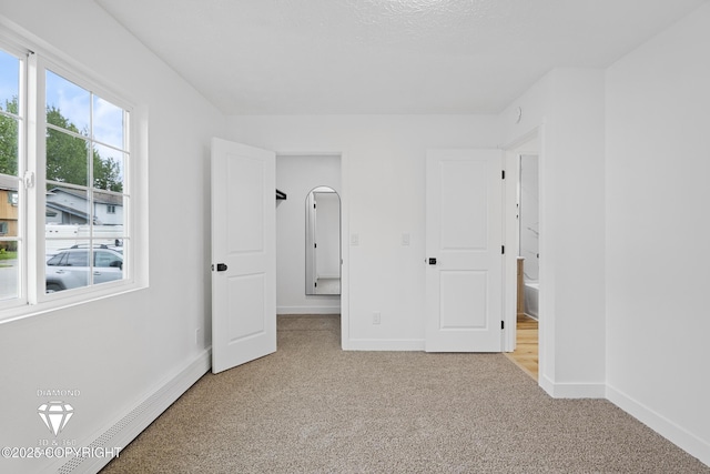 10108 Thimble Berry Dr, Anchorage, AK 99515 - unfurnished bedroom with light carpet, baseboards, and connected bathroom