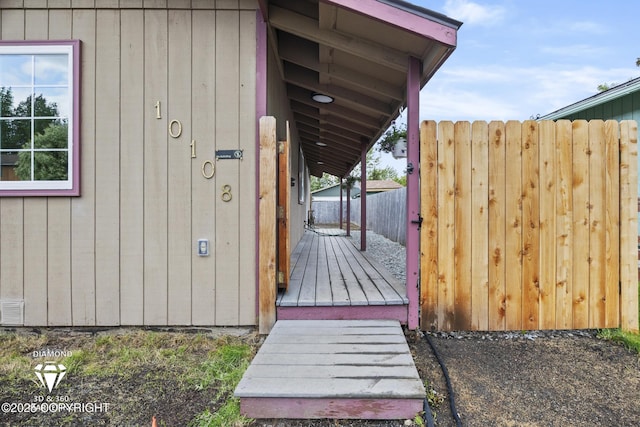 10108 Thimble Berry Dr, Anchorage, AK 99515 - doorway to property with a wooden deck