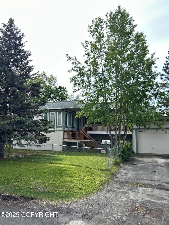 4148 W 88th Ave, Anchorage, AK 99502 - view of front of property featuring driveway and an attached garage