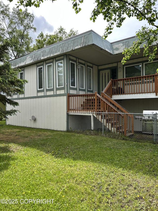4148 W 88th Ave, Anchorage, AK 99502 - rear view of property featuring a yard