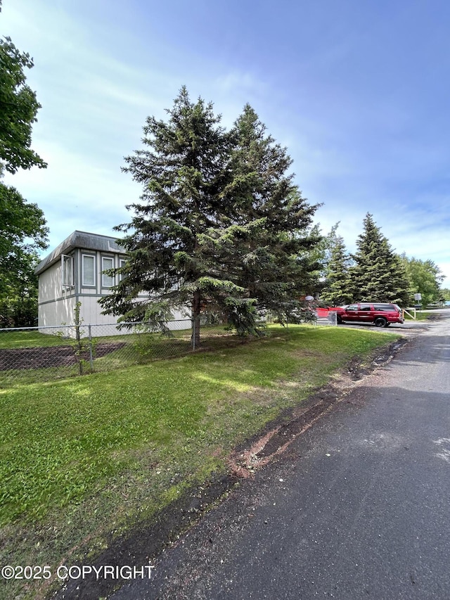 4148 W 88th Ave, Anchorage, AK 99502 - view of front of house featuring a front lawn