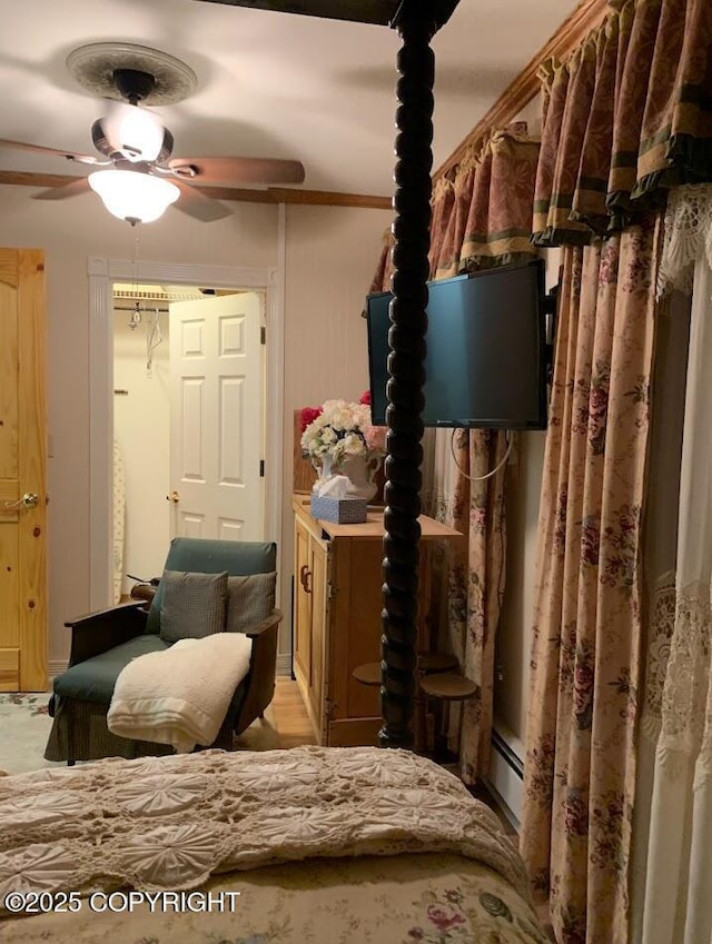 5411 Honeysuckle Ln, Wasilla, AK 99654 - bedroom featuring baseboard heating and a ceiling fan