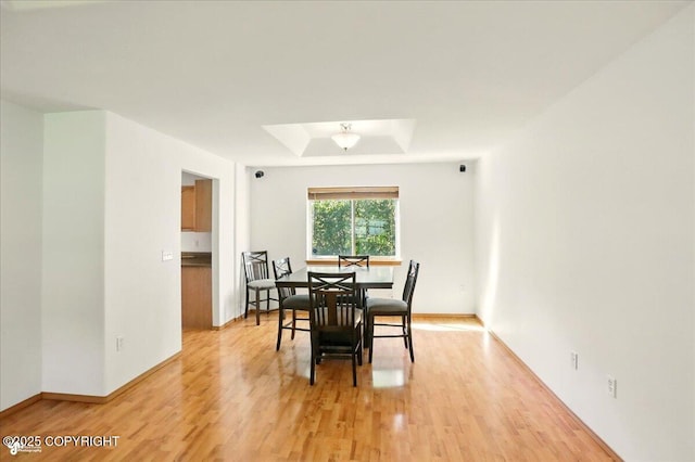 22030 Birch Creek Dr, Chugiak, AK 99567 - dining room featuring light wood-style flooring and baseboards