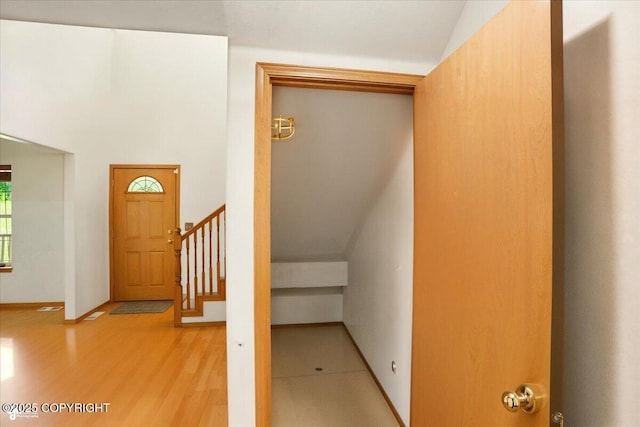 22030 Birch Creek Dr, Chugiak, AK 99567 - stairs with vaulted ceiling and wood finished floors