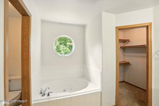 22030 Birch Creek Dr, Chugiak, AK 99567 - full bathroom featuring a jetted tub, toilet, and a spacious closet