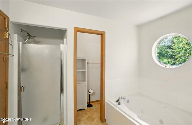 22030 Birch Creek Dr, Chugiak, AK 99567 - full bath with a shower stall, a whirlpool tub, and baseboards