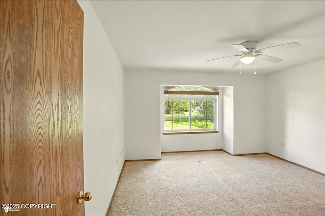22030 Birch Creek Dr, Chugiak, AK 99567 - carpeted spare room featuring ceiling fan and baseboards