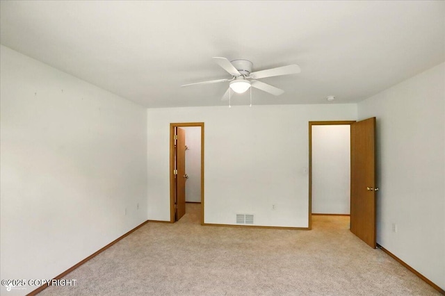 22030 Birch Creek Dr, Chugiak, AK 99567 - empty room with light colored carpet, ceiling fan, and baseboards