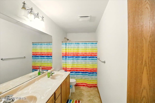 22030 Birch Creek Dr, Chugiak, AK 99567 - full bathroom featuring double vanity, toilet, and a shower with shower curtain